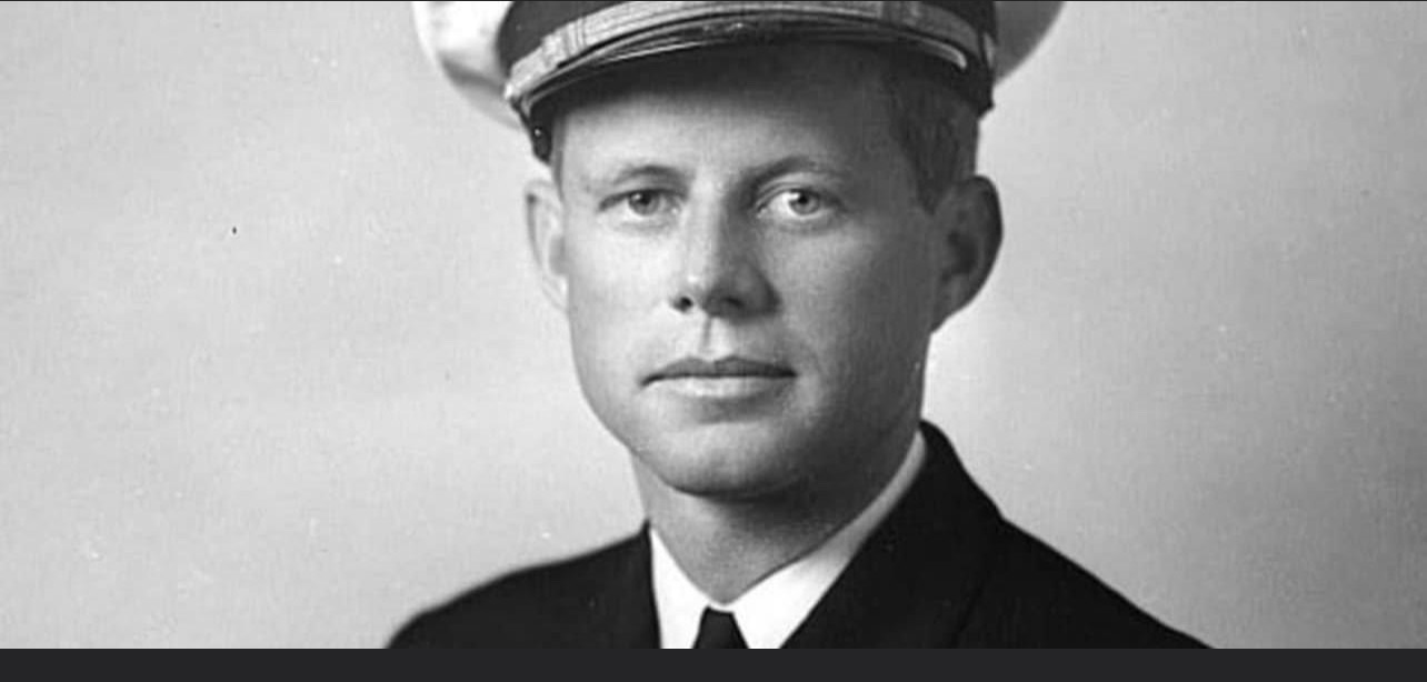 A black and white photo of a man in uniform.