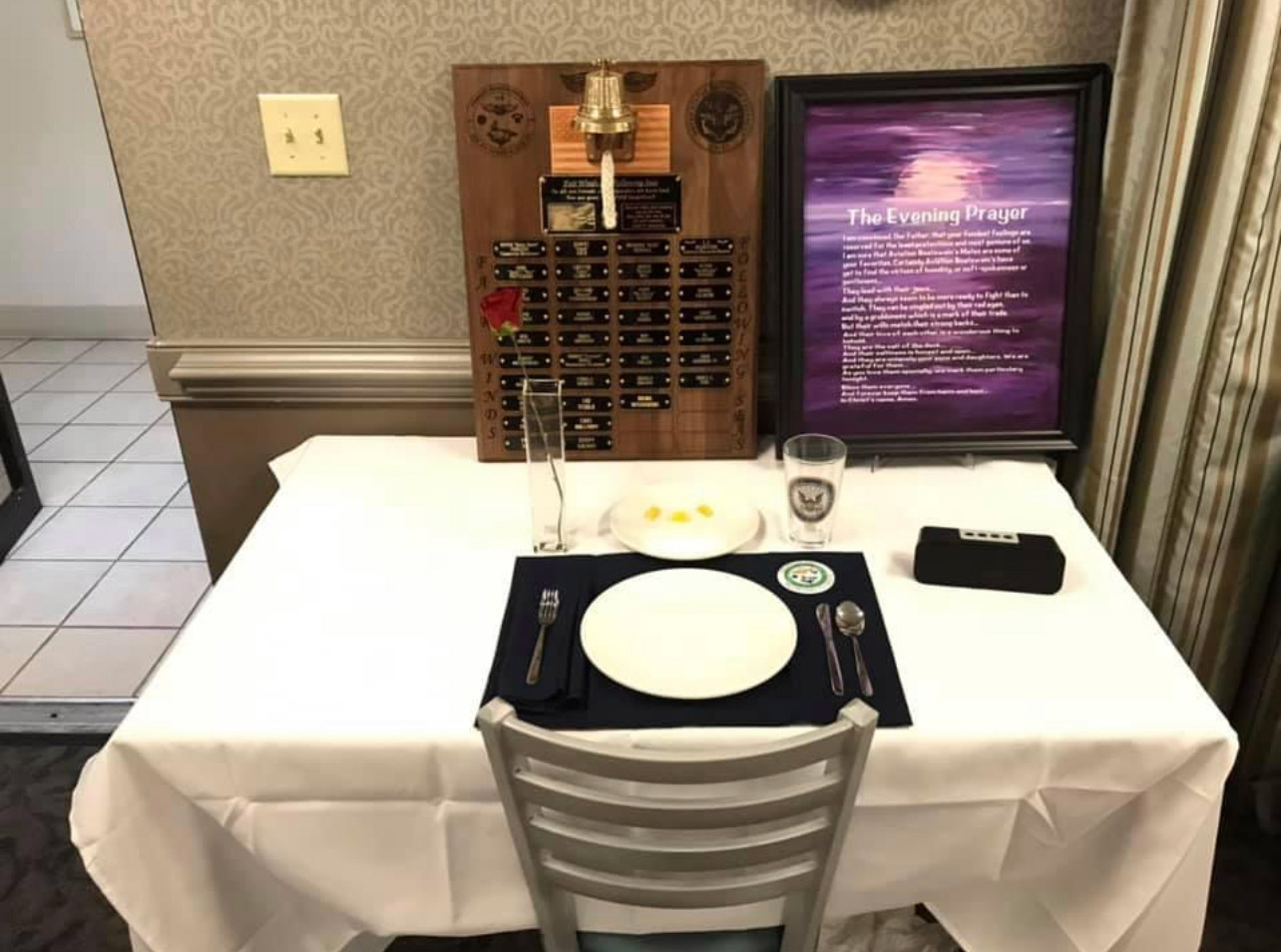 A table with silverware and plates on it