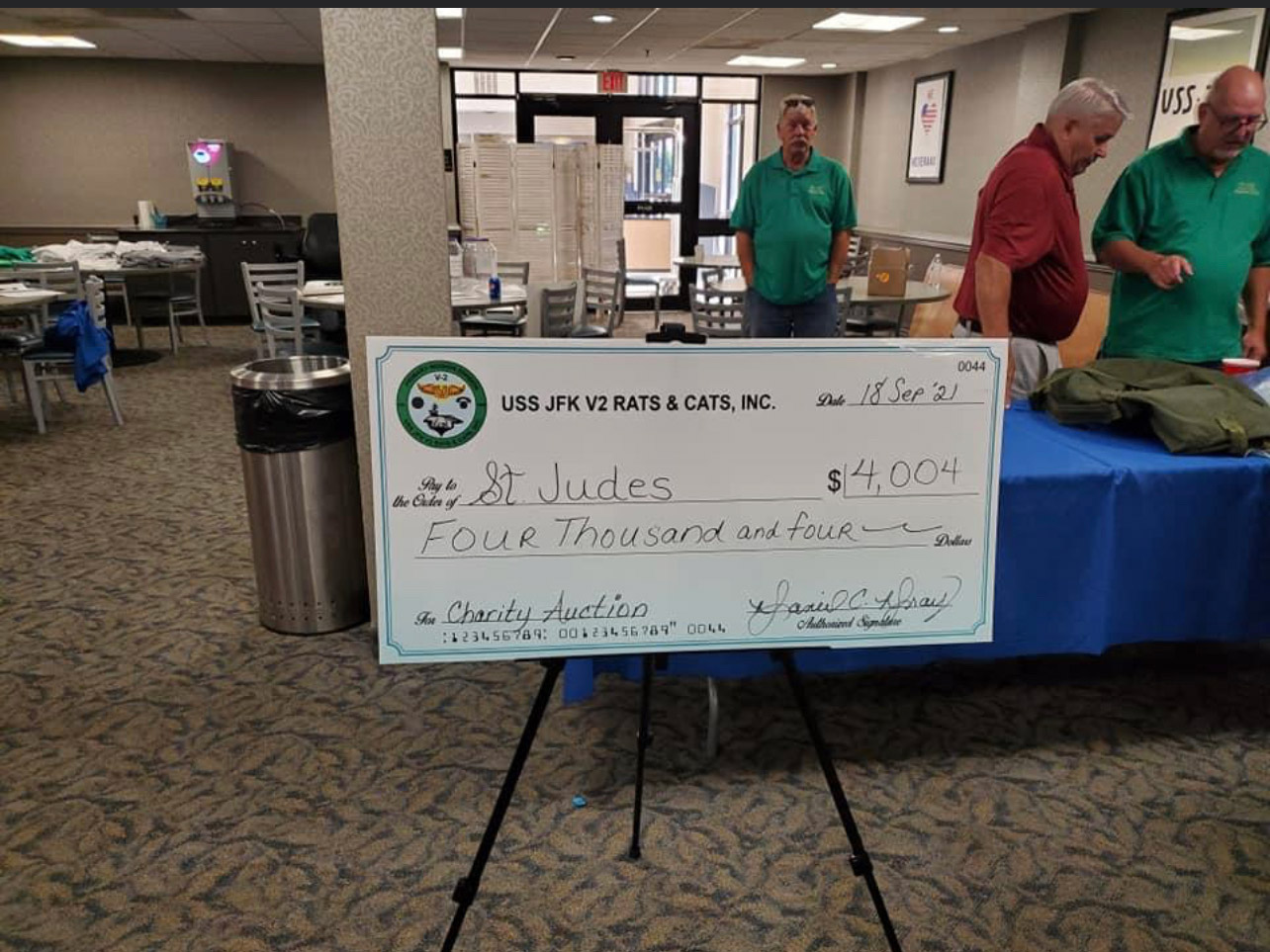 A large check is on display in the lobby.